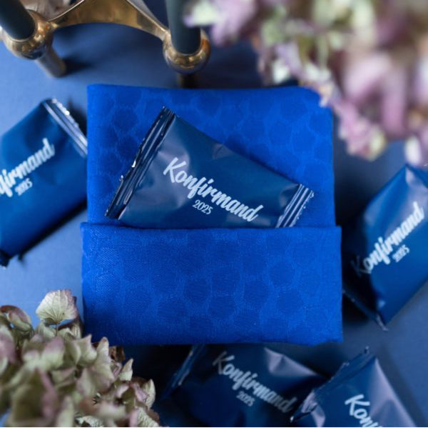 Blue CONFIRMATION BAGS WITH WHITE PRINT FILLED WITH HANDMADE BUNCHES: PERFECT TABLE DECORATIONS FOR CONFIRMATION