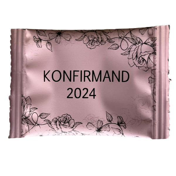 Lyserød Konfirmandpose med sort tryk og roser med håndlavede Bolcher: Elegant Bordpynt
