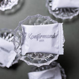 White Confirmation Bags with Silver Print Filled with Handmade Cookies: Perfect Table Decorations for Confirmation